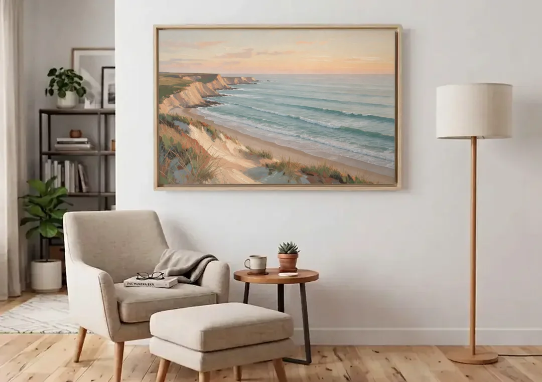 Peach Dawn Seascape Over Chalk Bluffs canvas wall art above an armchair in a bright living room