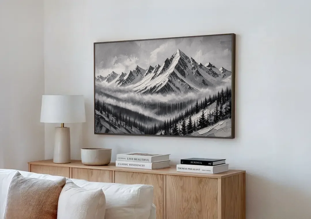 Snowy Mountain Peaks Above the Misty Firs canvas wall art above a wooden sideboard next to a sofa