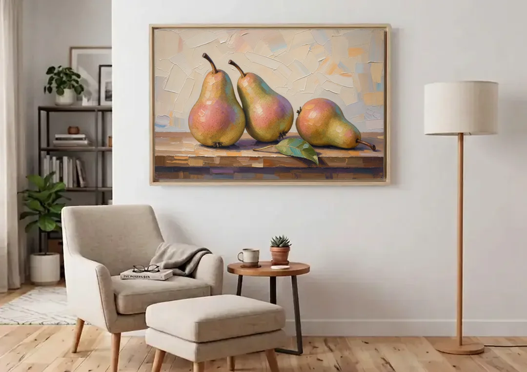 Pear Painting Trio with a Single Leaf canvas wall art above an armchair in a bright living room