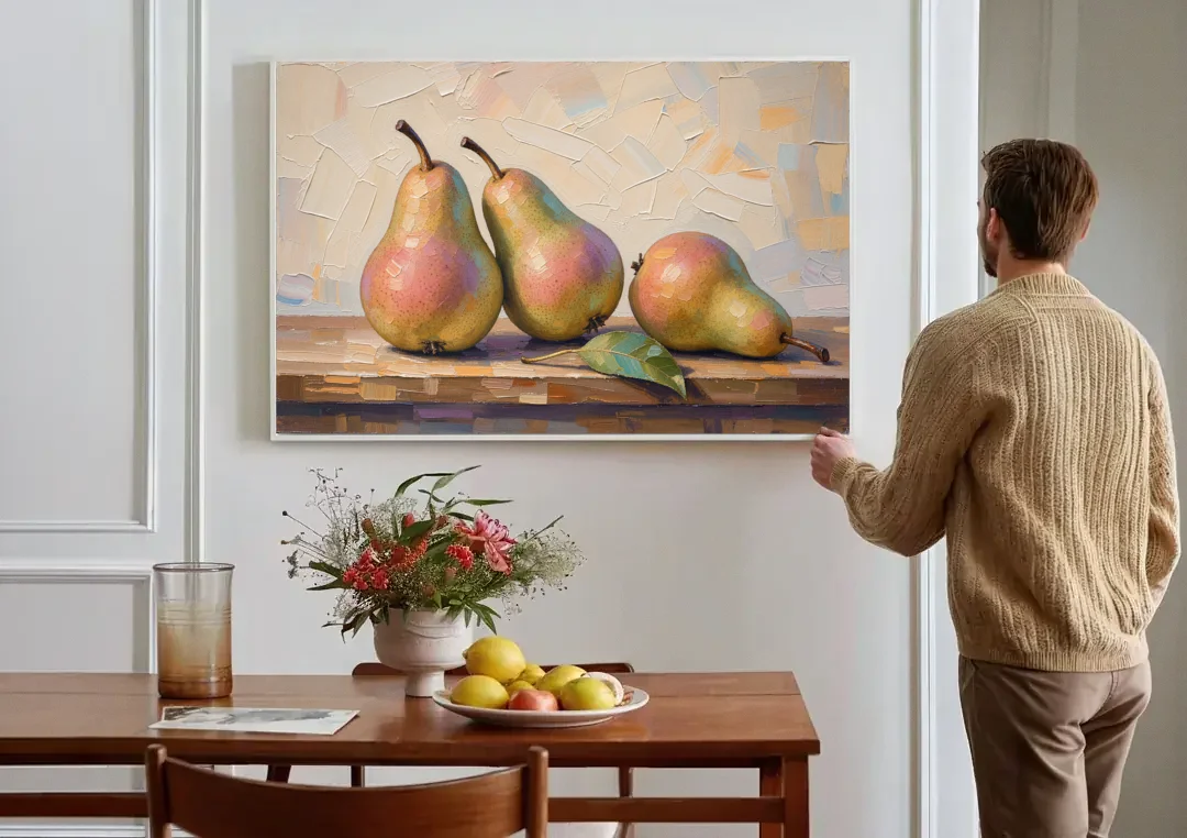 Pear Painting Trio with a Single Leaf canvas wall art above a dining table