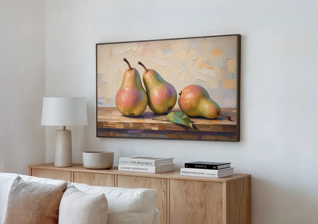 Pear Painting Trio with a Single Leaf canvas wall art above a wooden sideboard next to a sofa