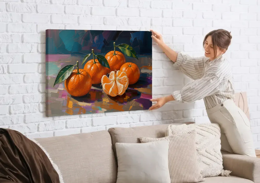 Peeled Clementine Cluster for the Contemporary Kitchen canvas wall art being hung on a white brick wall above a sofa