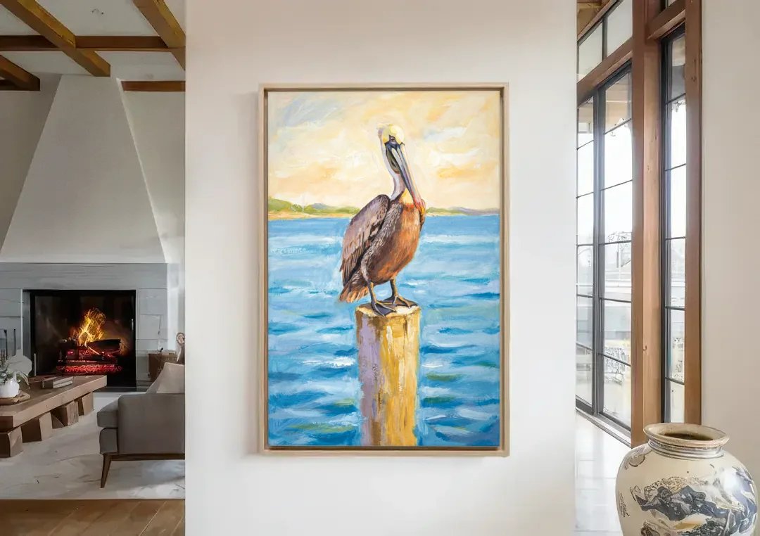 Pelican Painting on the Morning Piling canvas wall art in a living room with a fireplace