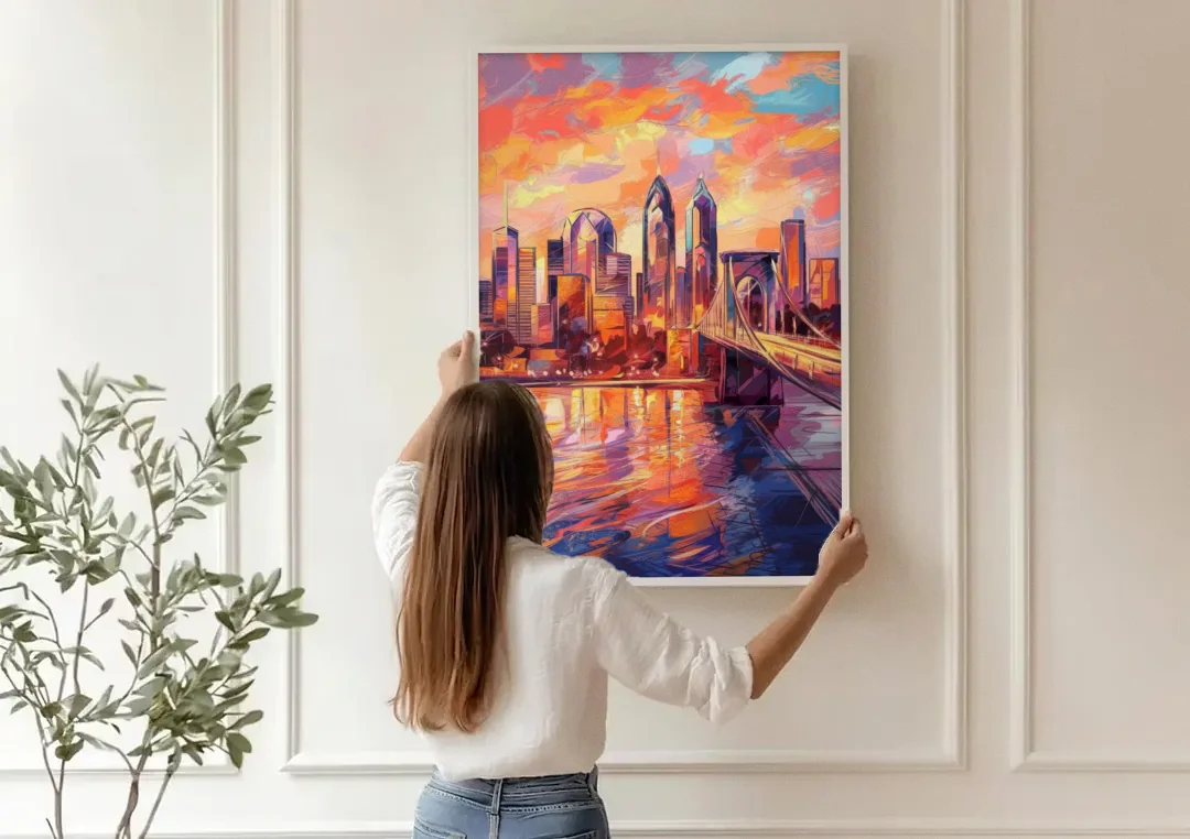 Philadelphia Skyline at Sunset canvas wall art being hung on a paneled wall