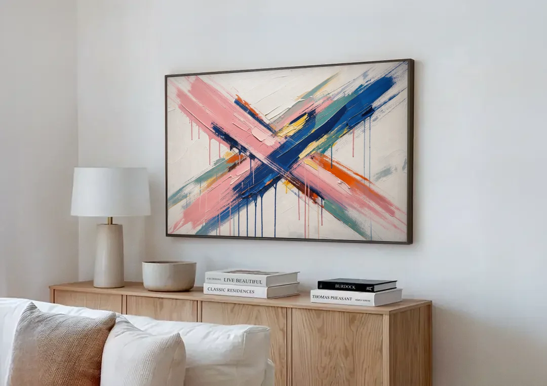 Pink and Blue Abstract Painting Crossed in Cobalt canvas wall art above a wooden sideboard next to a sofa