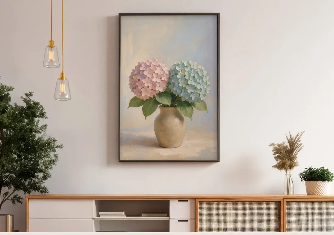 Pink and Blue Hydrangeas in a Sand Vase canvas wall art above a wooden sideboard under pendant lights