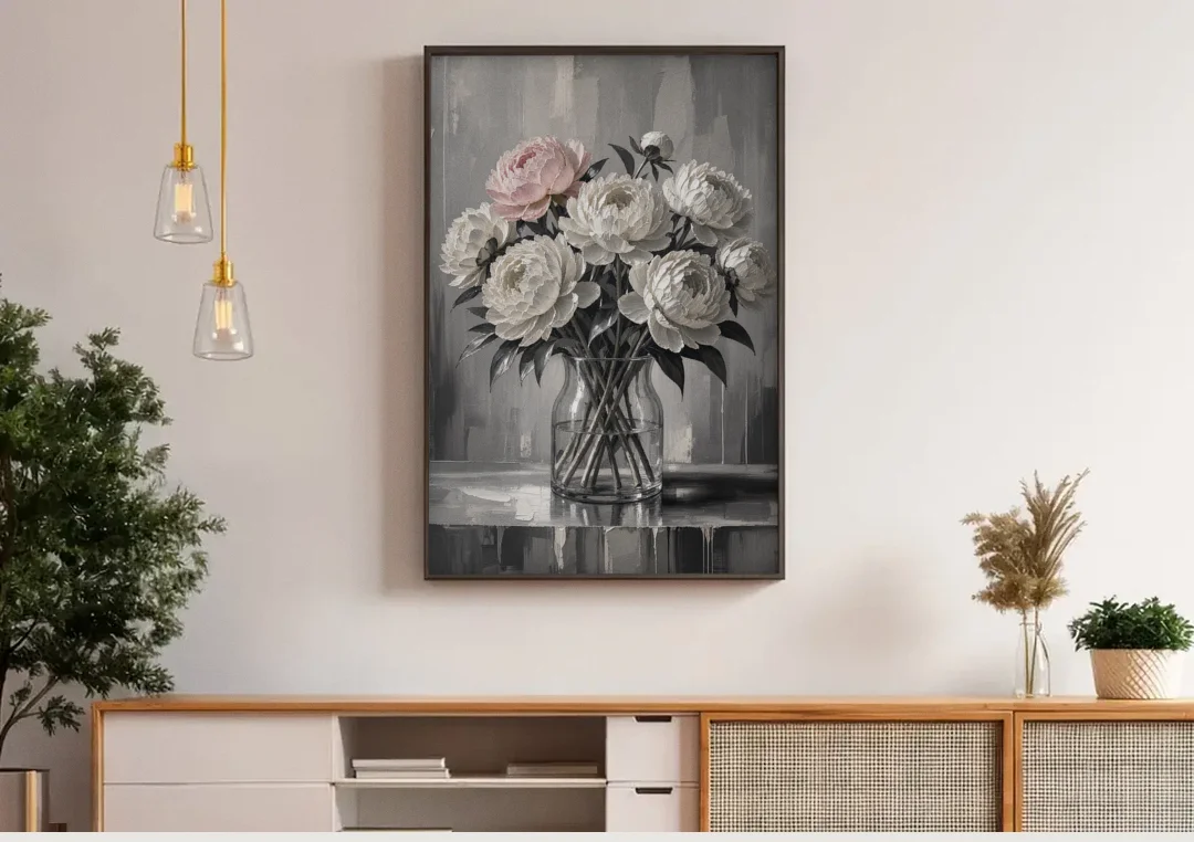Pink Black and White Wall Art of Peonies canvas wall art above a wooden sideboard under pendant lights