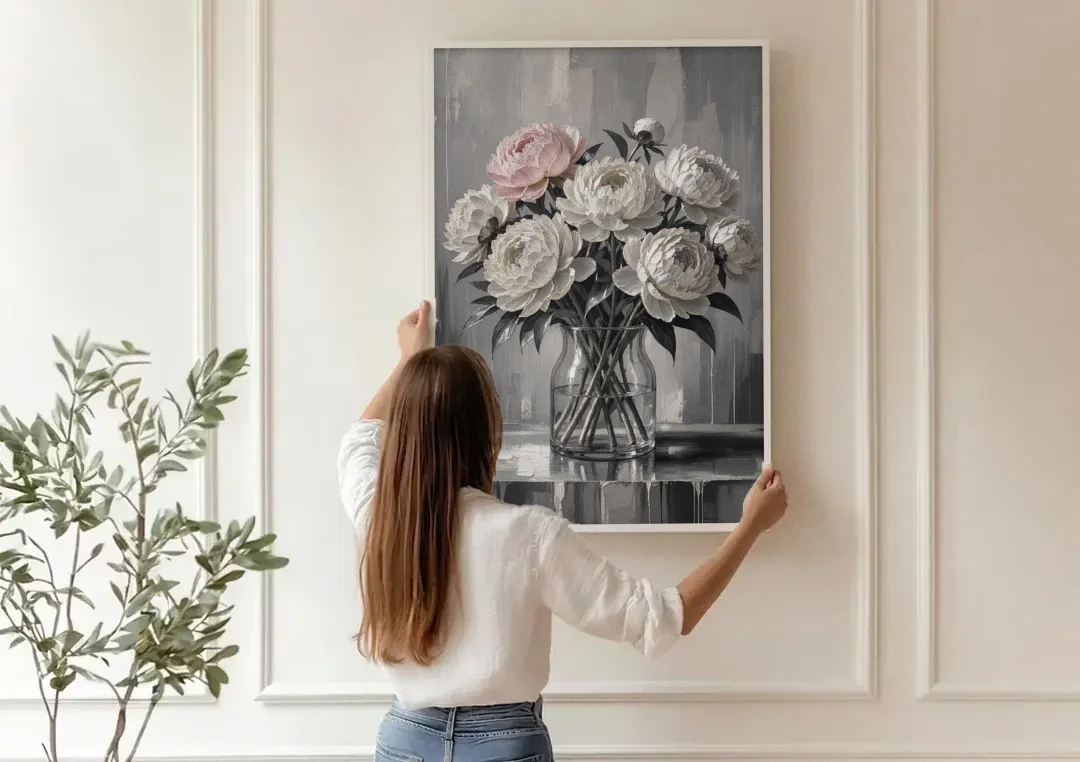 Pink Black and White Wall Art of Peonies canvas wall art being hung on a paneled wall