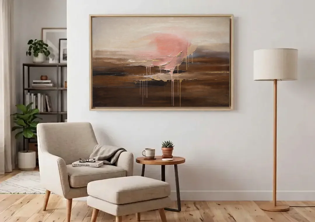 Pink Brown Wall Art with Blush Cloud and Gold Drips canvas wall art above an armchair in a bright living room
