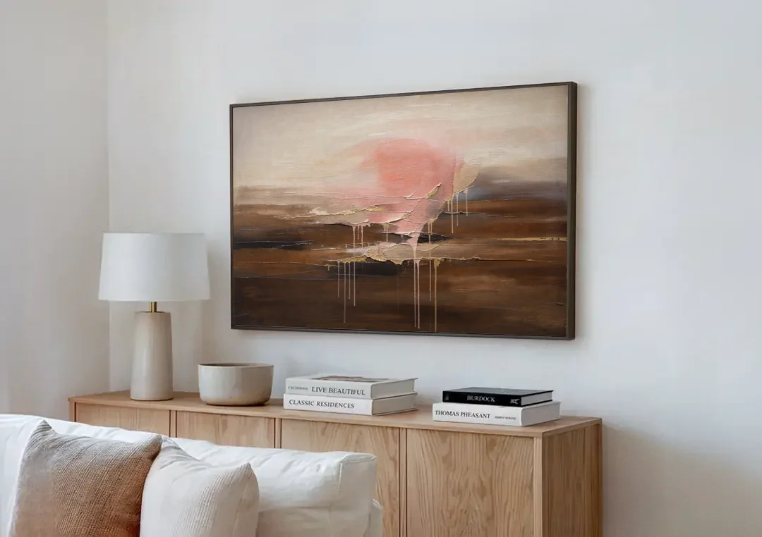 Pink Brown Wall Art with Blush Cloud and Gold Drips canvas wall art above a wooden sideboard next to a sofa