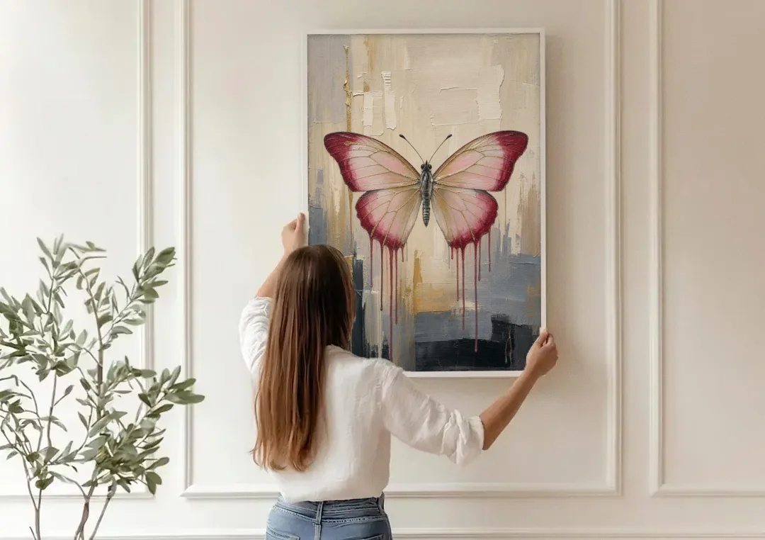 Pink Butterfly with Crimson Drips canvas wall art being hung on a paneled wall