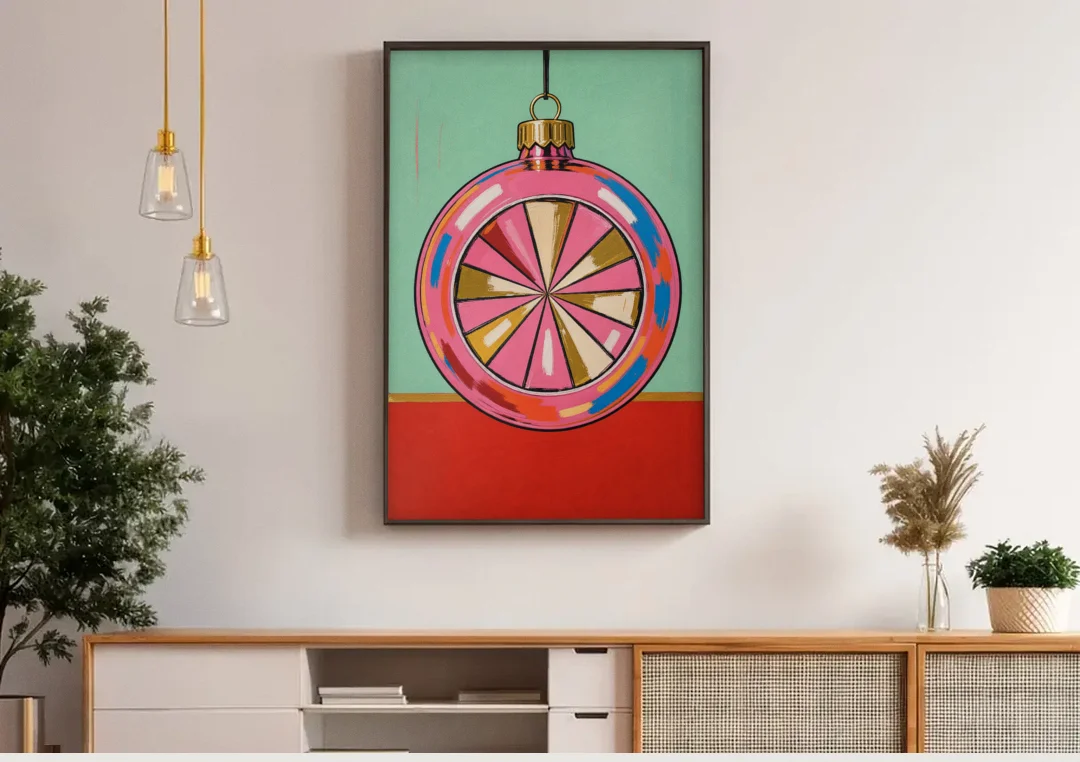 Pink Christmas Wall Art of a Glass Reflector Ornament canvas wall art above a wooden sideboard under pendant lights