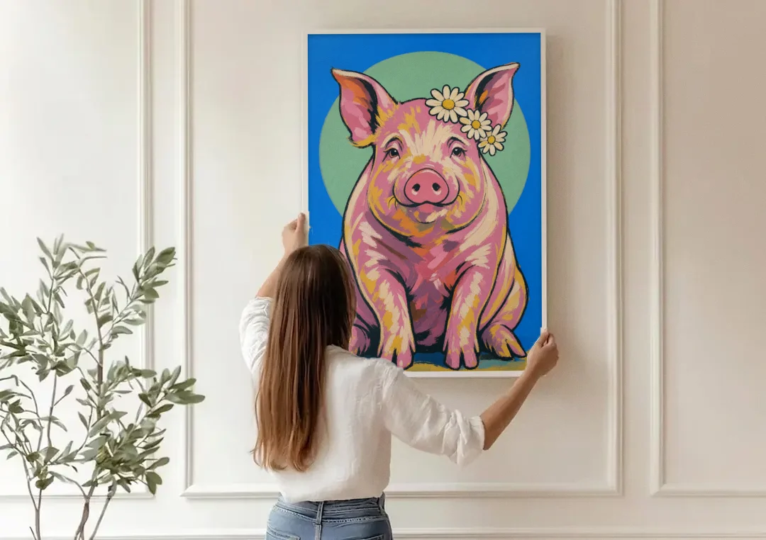 Pink Pig with a Slipping Daisy Crown canvas wall art being hung on a paneled wall