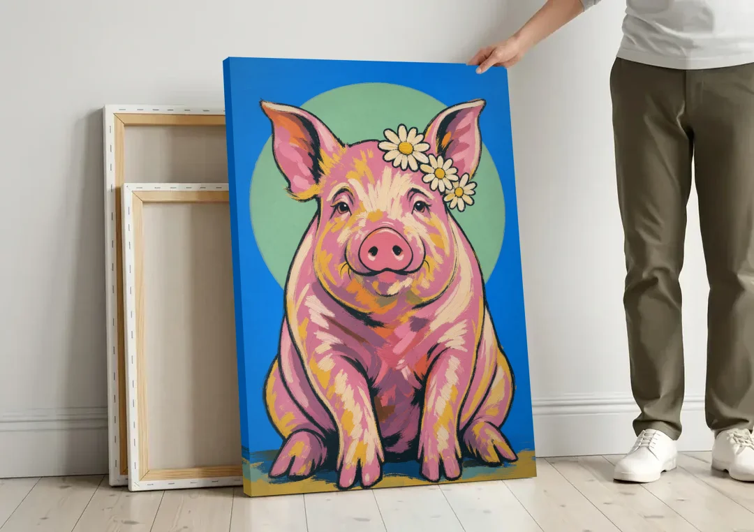 Pink Pig with a Slipping Daisy Crown canvas wall art leaning against a wall next to blank canvases