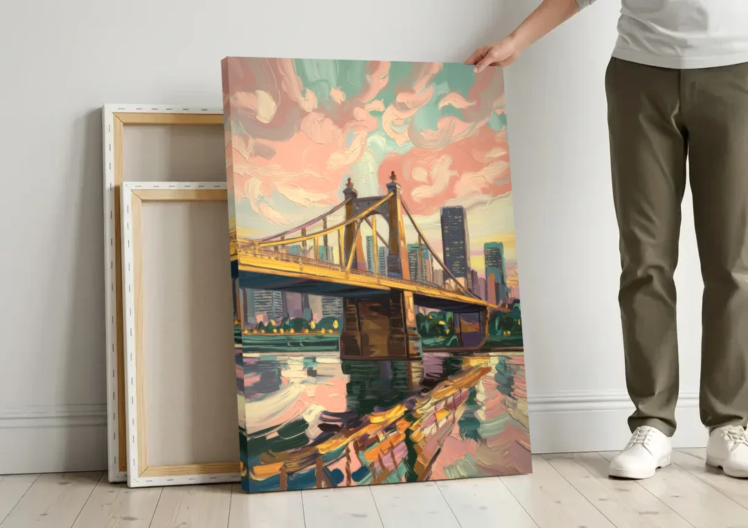 Pittsburgh Bridges and Rivers canvas wall art leaning against a wall next to blank canvases