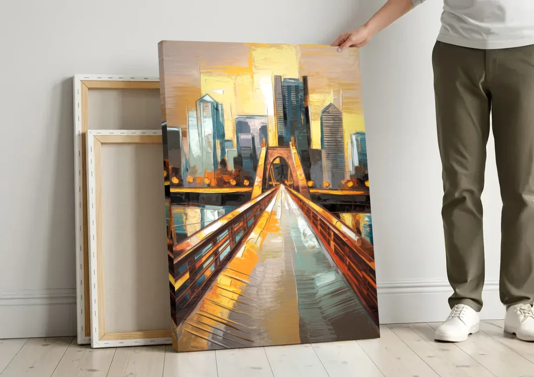 Pittsburgh City of Bridges canvas wall art leaning against a wall next to blank canvases