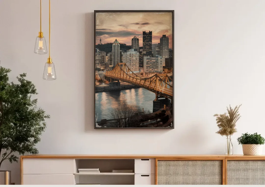 Pittsburgh Historic Landmarks canvas wall art above a wooden sideboard under pendant lights
