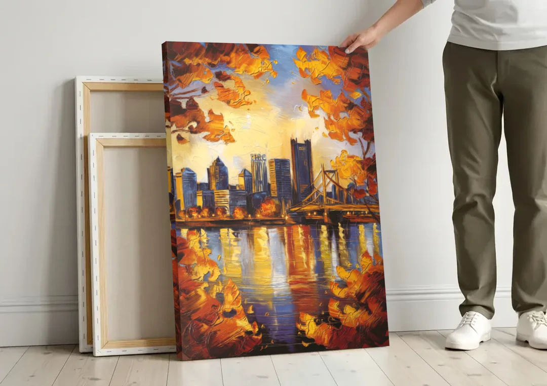 Pittsburgh Skyline in Autumn canvas wall art leaning against a wall next to blank canvases