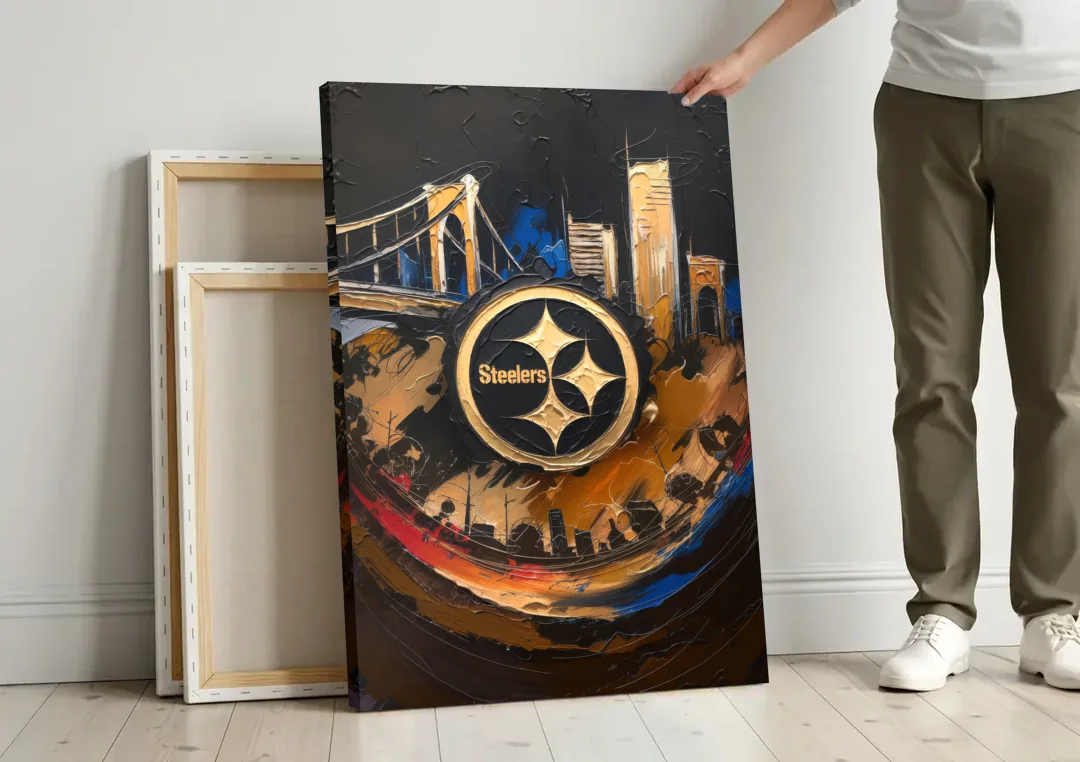 Pittsburgh Steelers Fan Pride canvas wall art leaning against a wall next to blank canvases