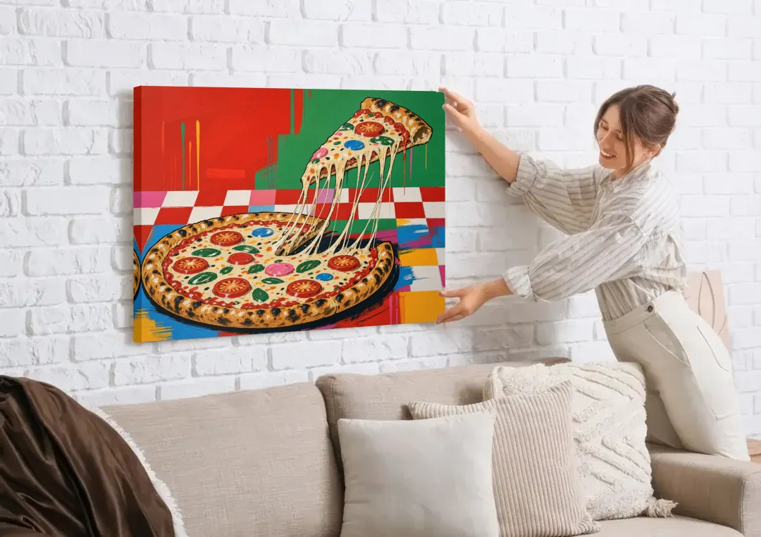 Pizza Poster with the Cheese Pull canvas wall art being hung on a white brick wall above a sofa