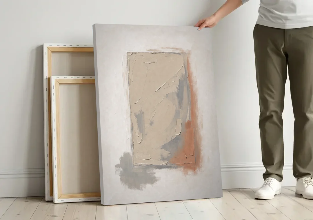 Plaster Texture Wall Art with Terracotta Shadow canvas wall art leaning against a wall next to blank canvases