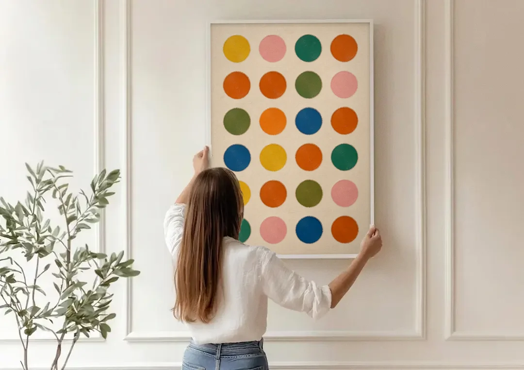 Playroom Wall Art with Twenty-Four Painted Dots canvas wall art being hung on a paneled wall