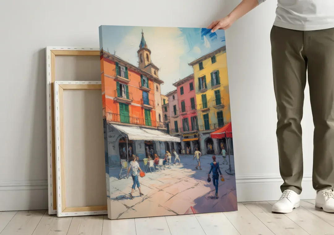 Plaza Mayor Charm canvas wall art leaning against a wall next to blank canvases