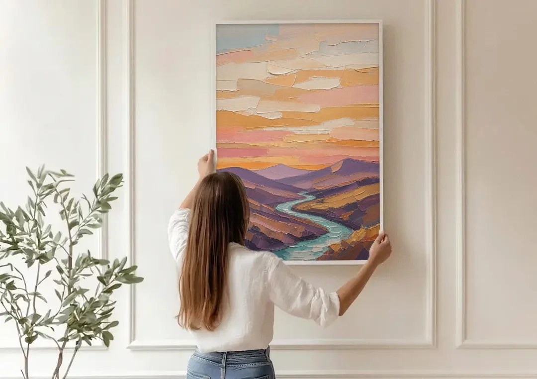 Plum Hills and Teal River at Sunset canvas wall art being hung on a paneled wall