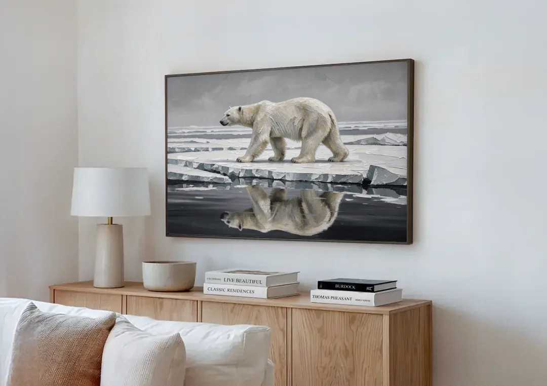 Black and White Polar Bear on Broken Sea Ice canvas wall art above a wooden sideboard next to a sofa