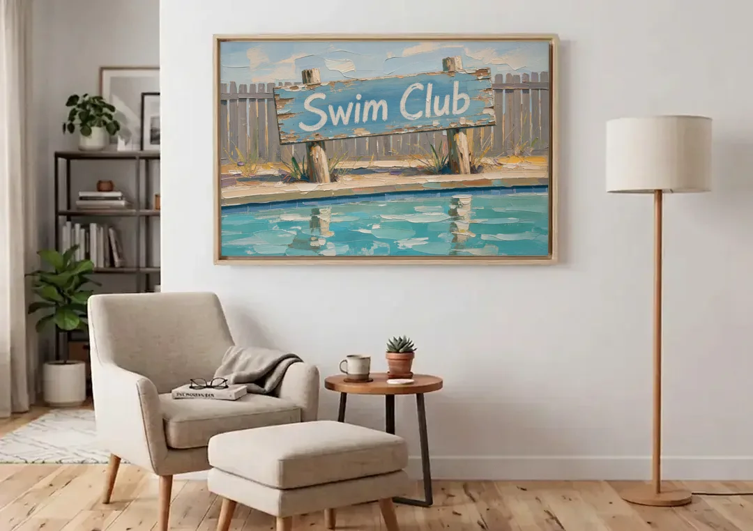 Pool Signs for Backyard Swim Club Board canvas wall art above an armchair in a bright living room