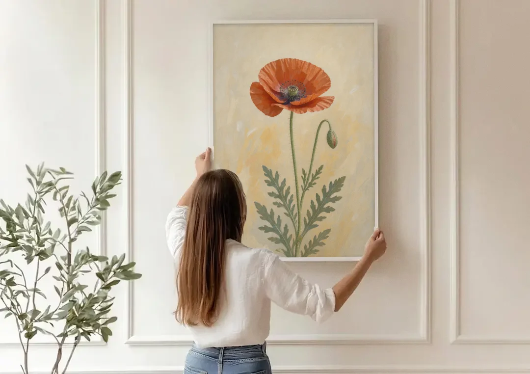 Poppy Wall Art with a Bowed Bud canvas wall art being hung on a paneled wall