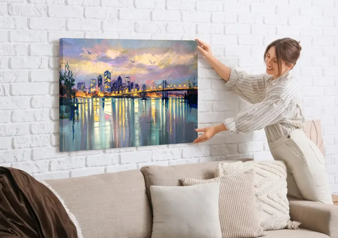 Portland Waterfront Reflection canvas wall art being hung on a white brick wall above a sofa