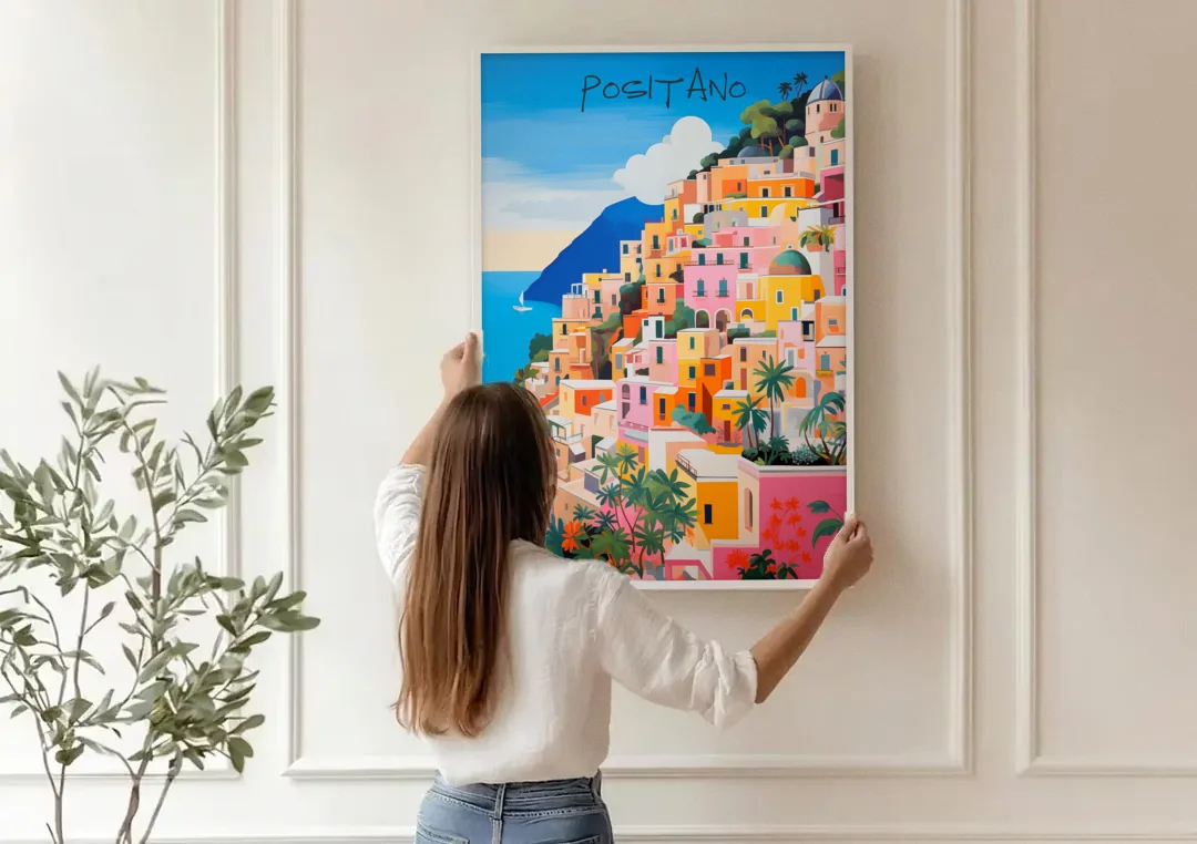 Positano Painting of Cliffside Houses canvas wall art being hung on a paneled wall