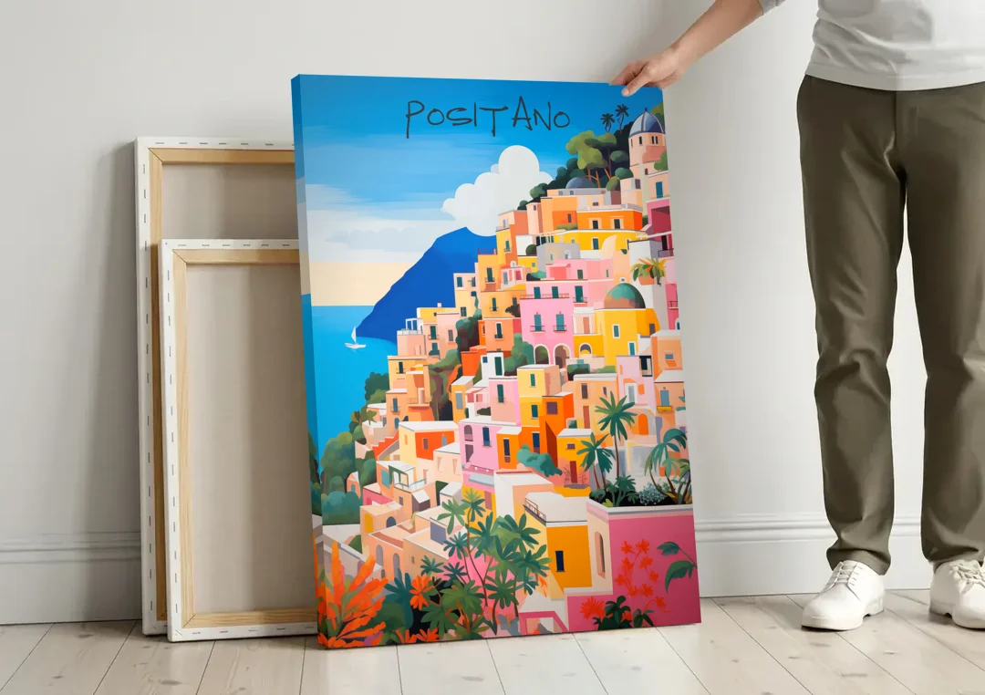Positano Painting of Cliffside Houses canvas wall art leaning against a wall next to blank canvases