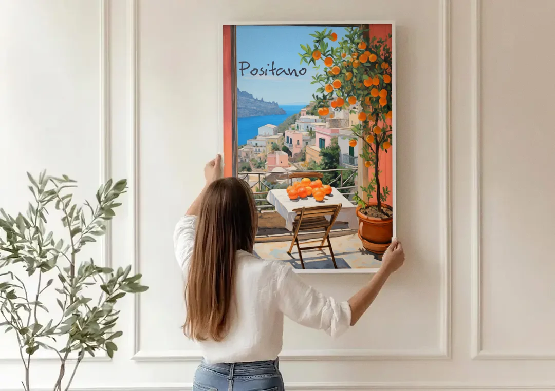 Positano Wall Art with an Orange Tree canvas wall art being hung on a paneled wall