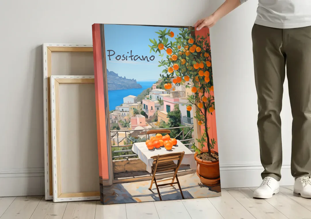 Positano Wall Art with an Orange Tree canvas wall art leaning against a wall next to blank canvases