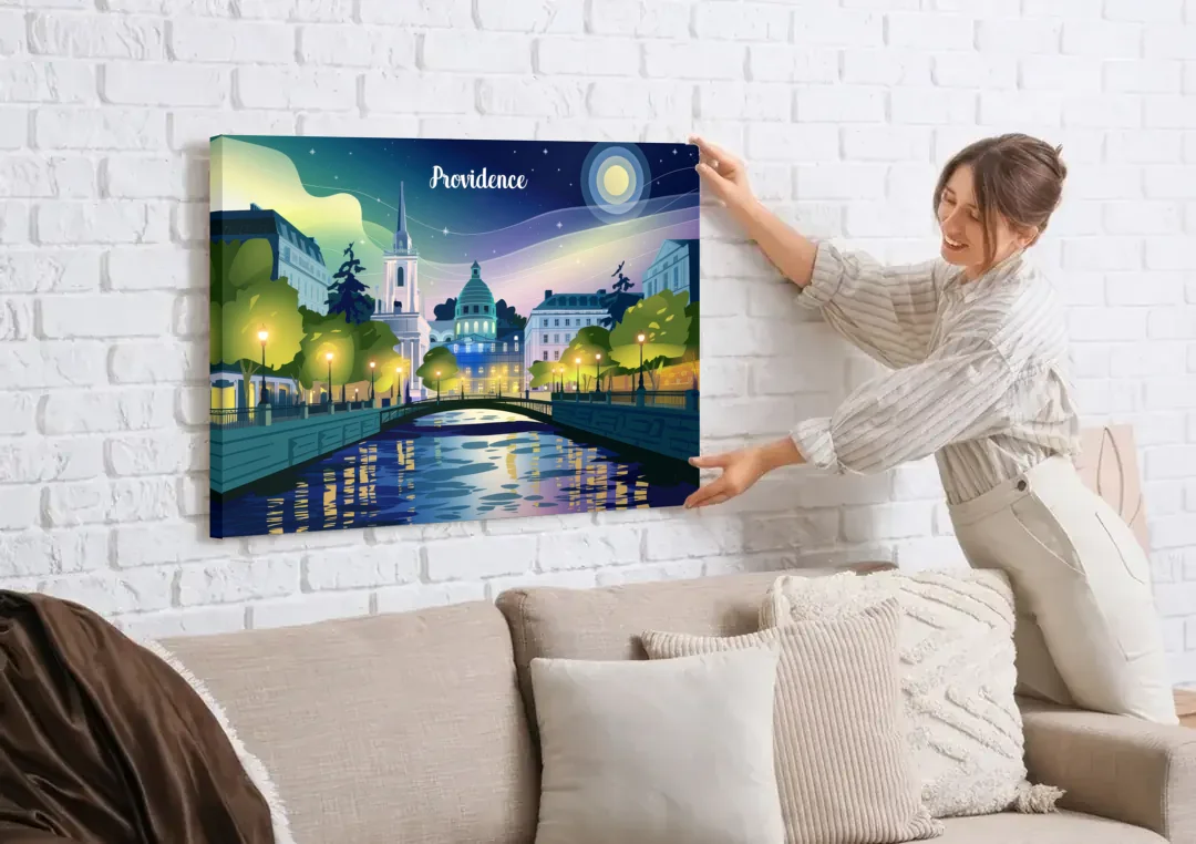 Providence Night Lights canvas wall art being hung on a white brick wall above a sofa