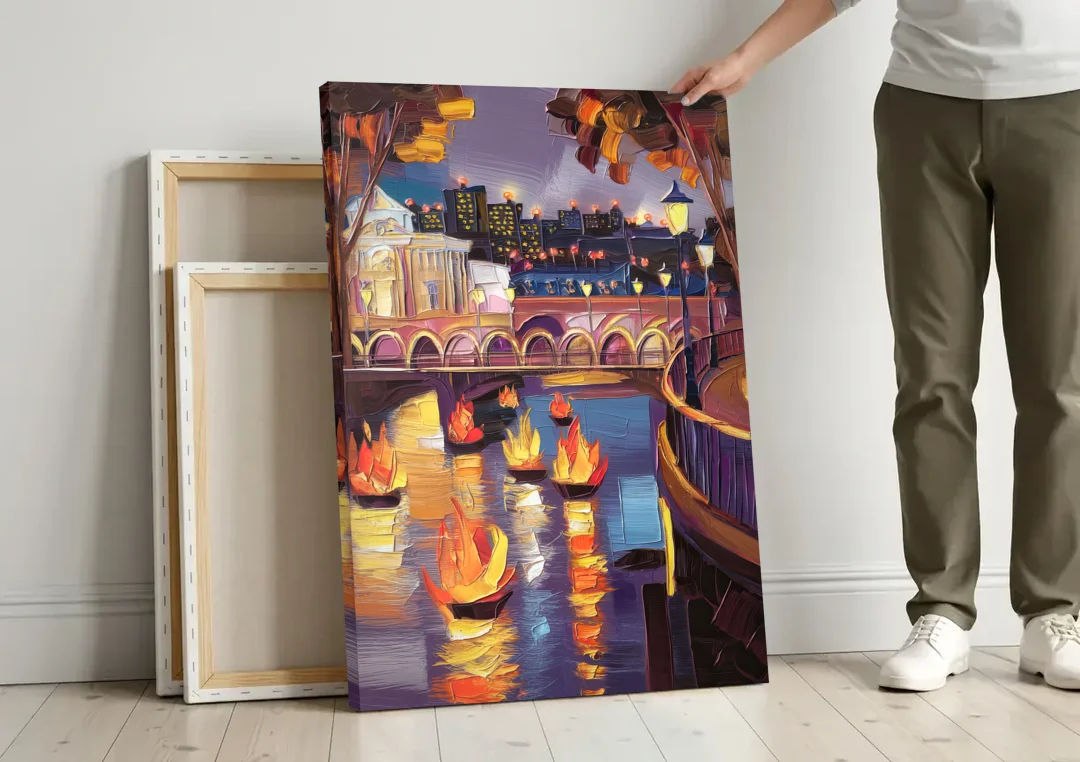 Providence Waterfire Glow canvas wall art leaning against a wall next to blank canvases