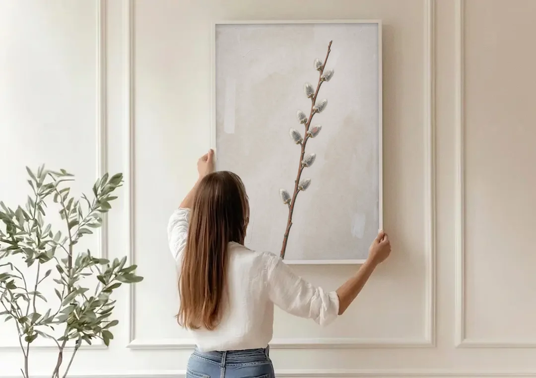 Pussy Willow Branch with Silver Catkins canvas wall art being hung on a paneled wall