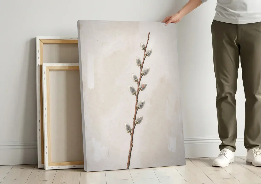 Pussy Willow Branch with Silver Catkins canvas wall art leaning against a wall next to blank canvases