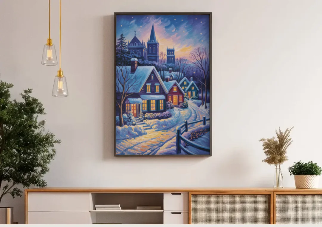 Quebec Snowy Village Scene canvas wall art above a wooden sideboard under pendant lights