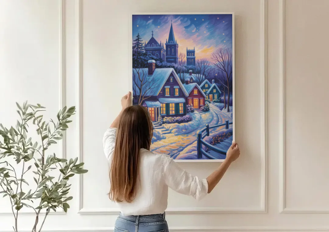 Quebec Snowy Village Scene canvas wall art being hung on a paneled wall