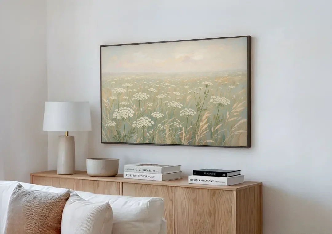 Queen Anne's Lace Art of a Misty Sage Meadow canvas wall art above a wooden sideboard next to a sofa