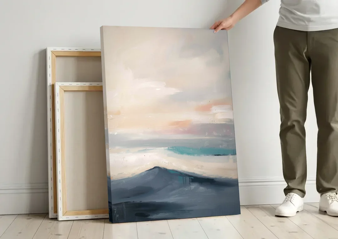 Minimalist Quiet Mountain Ridge with Teal Crest canvas wall art leaning against a wall next to blank canvases