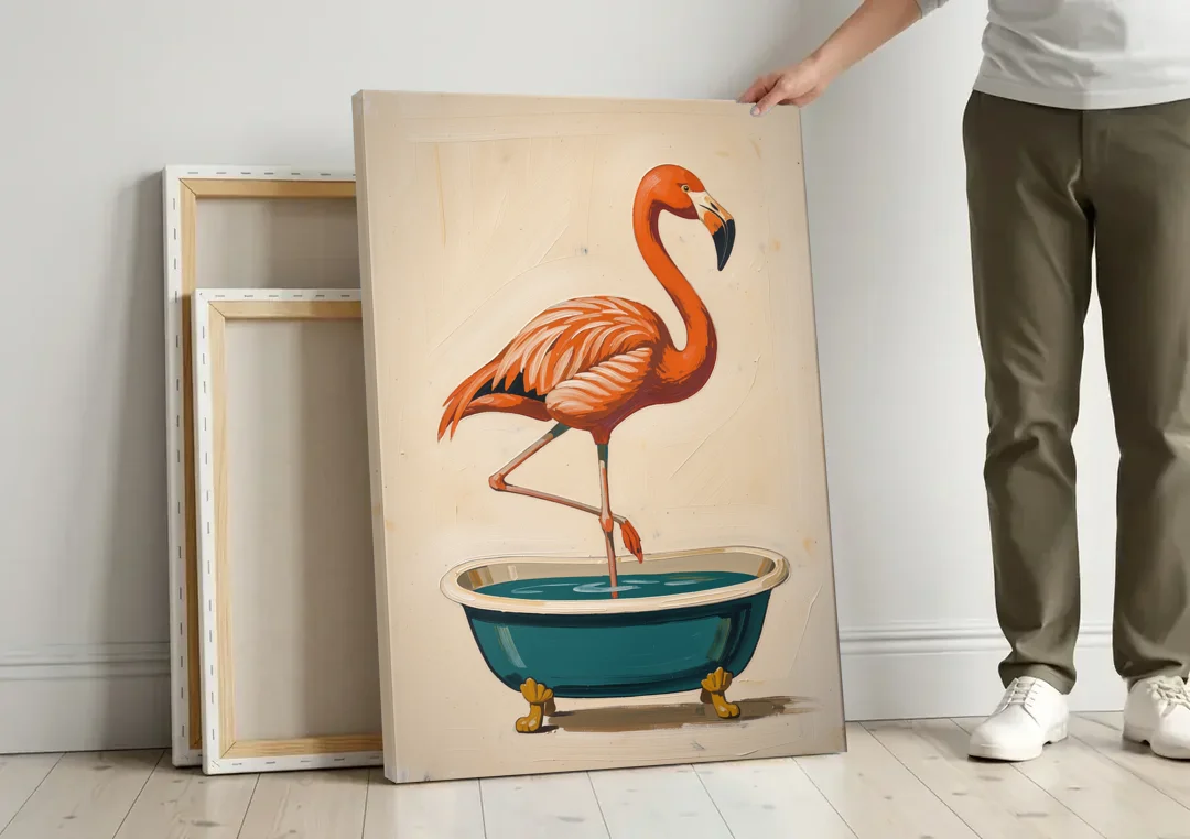 Quirky Bathroom Wall Art Flamingo in a Clawfoot Tub canvas wall art leaning against a wall next to blank canvases
