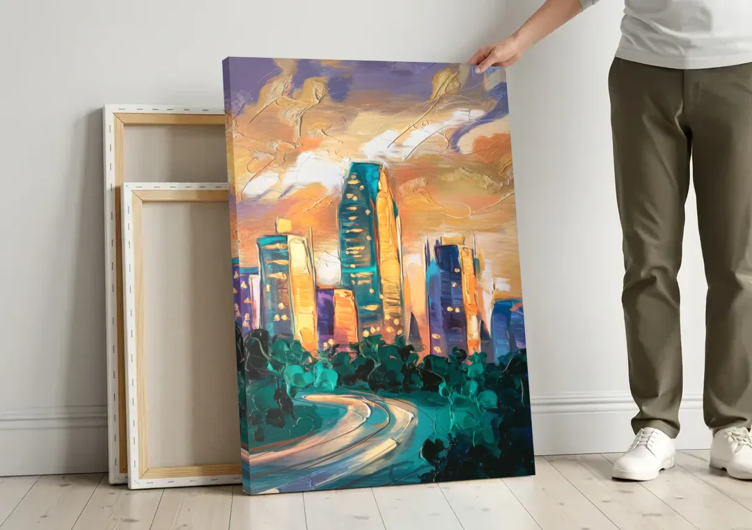 Raleigh Contemporary Cityscape canvas wall art leaning against a wall next to blank canvases