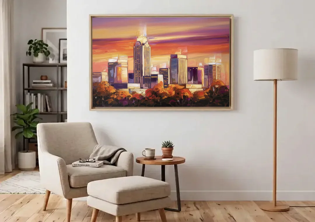 Raleigh Skyline Sunset canvas wall art above an armchair in a bright living room