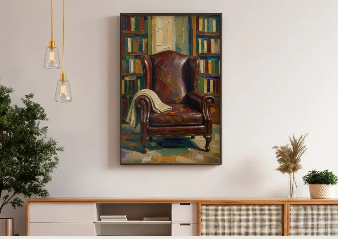 Reading Room Decor with an Oxblood Wingback Chair canvas wall art above a wooden sideboard under pendant lights