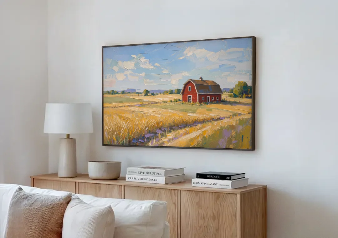 Red Barn Across Golden Grain Fields canvas wall art above a wooden sideboard next to a sofa