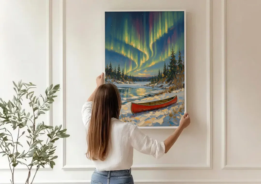 Red Canoe Under the Northern Lights canvas wall art being hung on a paneled wall